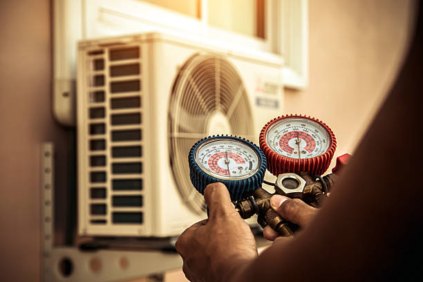 Professional Heat Pump Repair technician working in Haltom City, TX